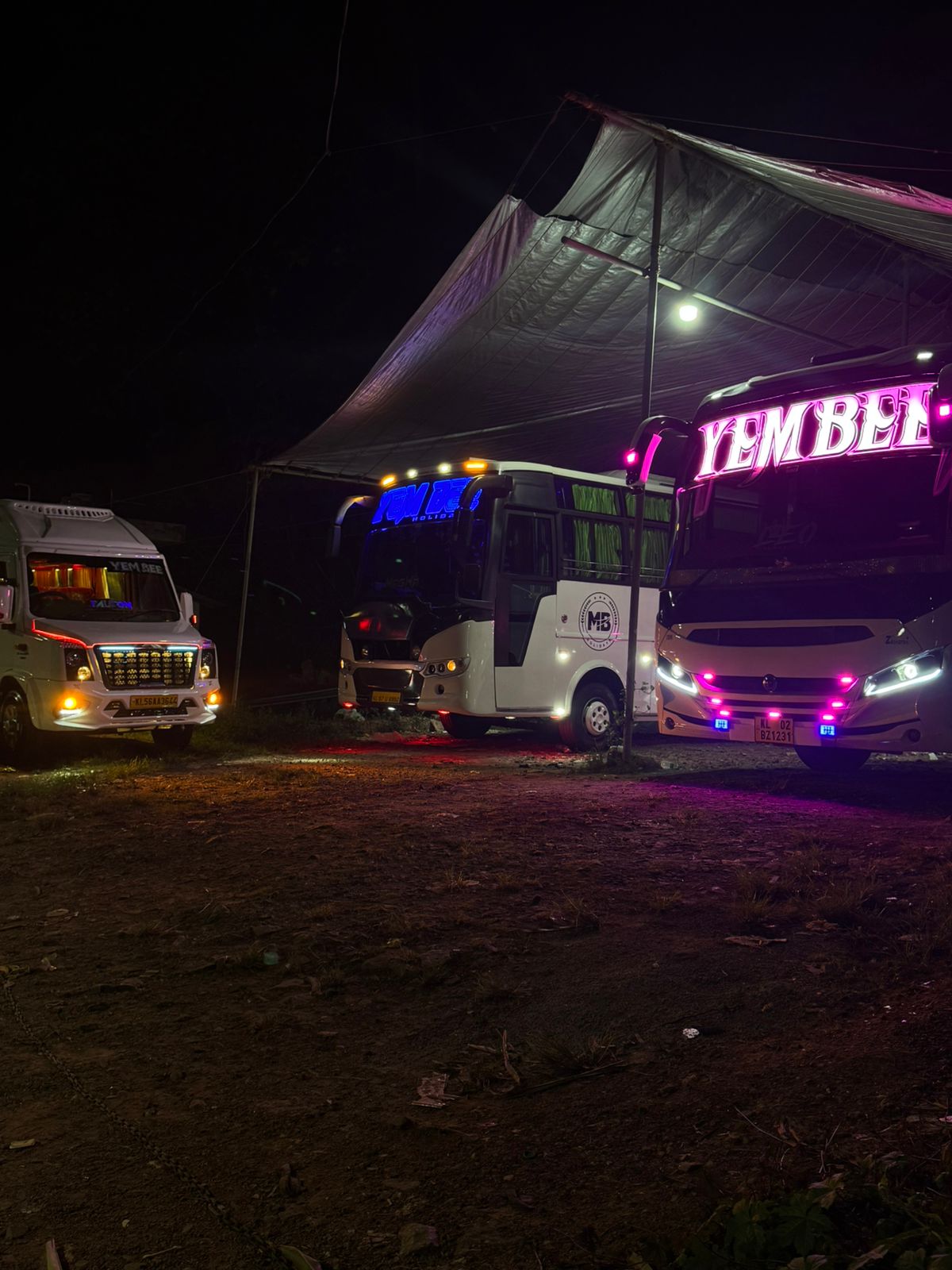 Fleet parked at a night halt with lights on